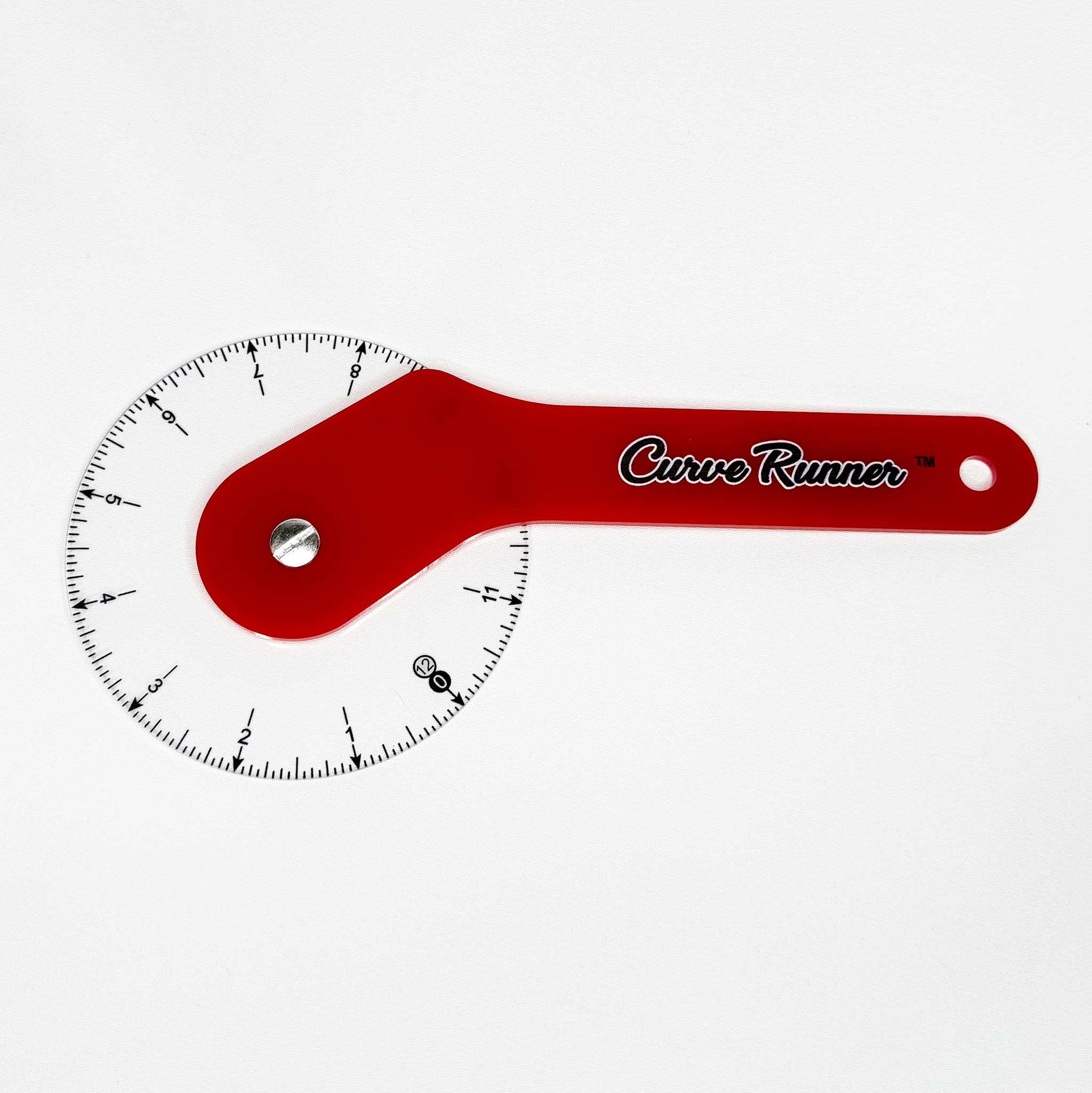 a hand held measuring device for measuring sewing pattern curves.  It has a red handle and the words in black ink that say Curve Runner,  the ruler has a transparent wheel with black inches measured around the wheel.