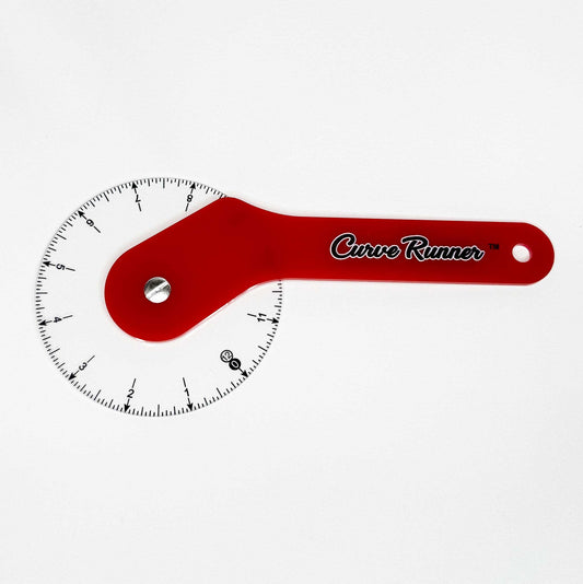 a hand held measuring device for measuring sewing pattern curves.  It has a red handle and the words in black ink that say Curve Runner,  the ruler has a transparent wheel with black inches measured around the wheel.