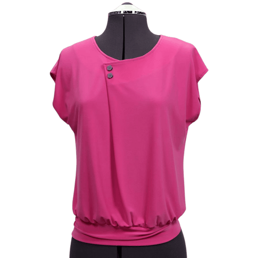 A pink shirt on a mannequin with two buttons on the left neckline