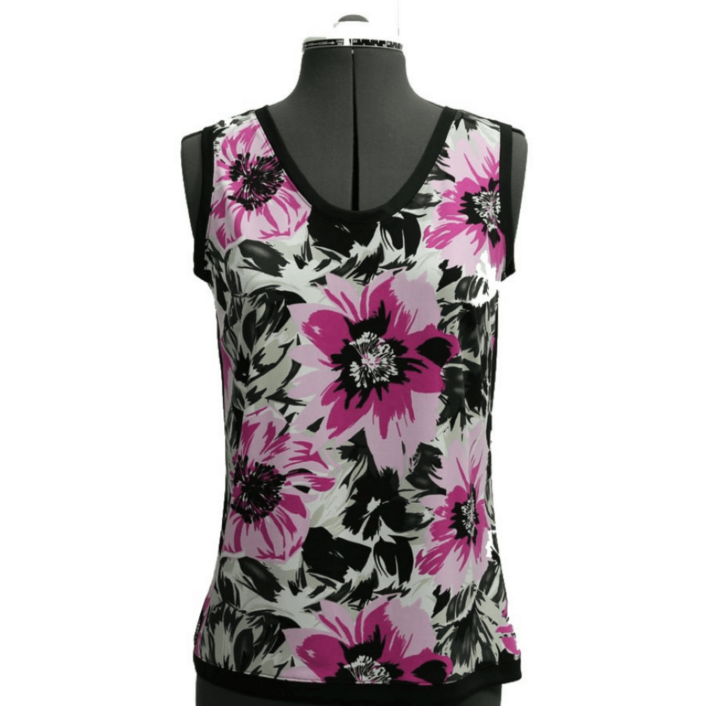A floral tank top on a gray mannequin made of pink and black flowers on a gray background.