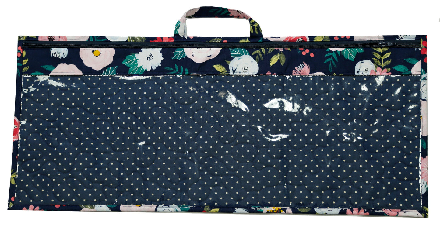A large rectalngle shaped zippered bag that is clear vinyl on the front to see through