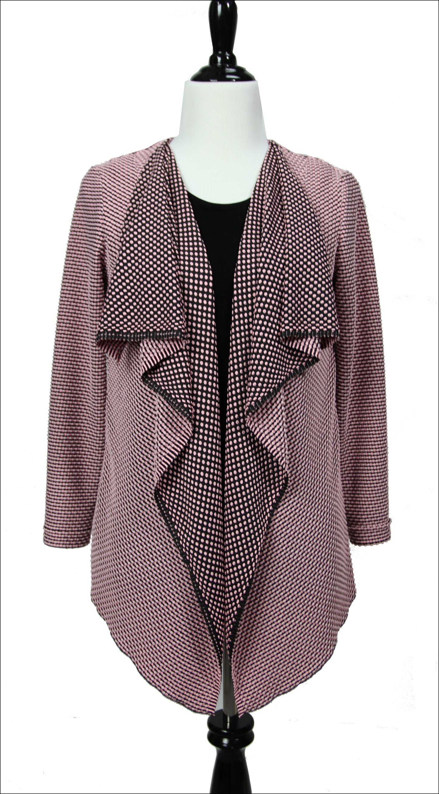 A flowy long sleeve open faced jacket on a mannequin made of black and dusty pink fabric