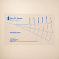 A Sure-Fit Designs Adjust-A-Bust paper sizing chart with blue printed lines and text on a light beige background.