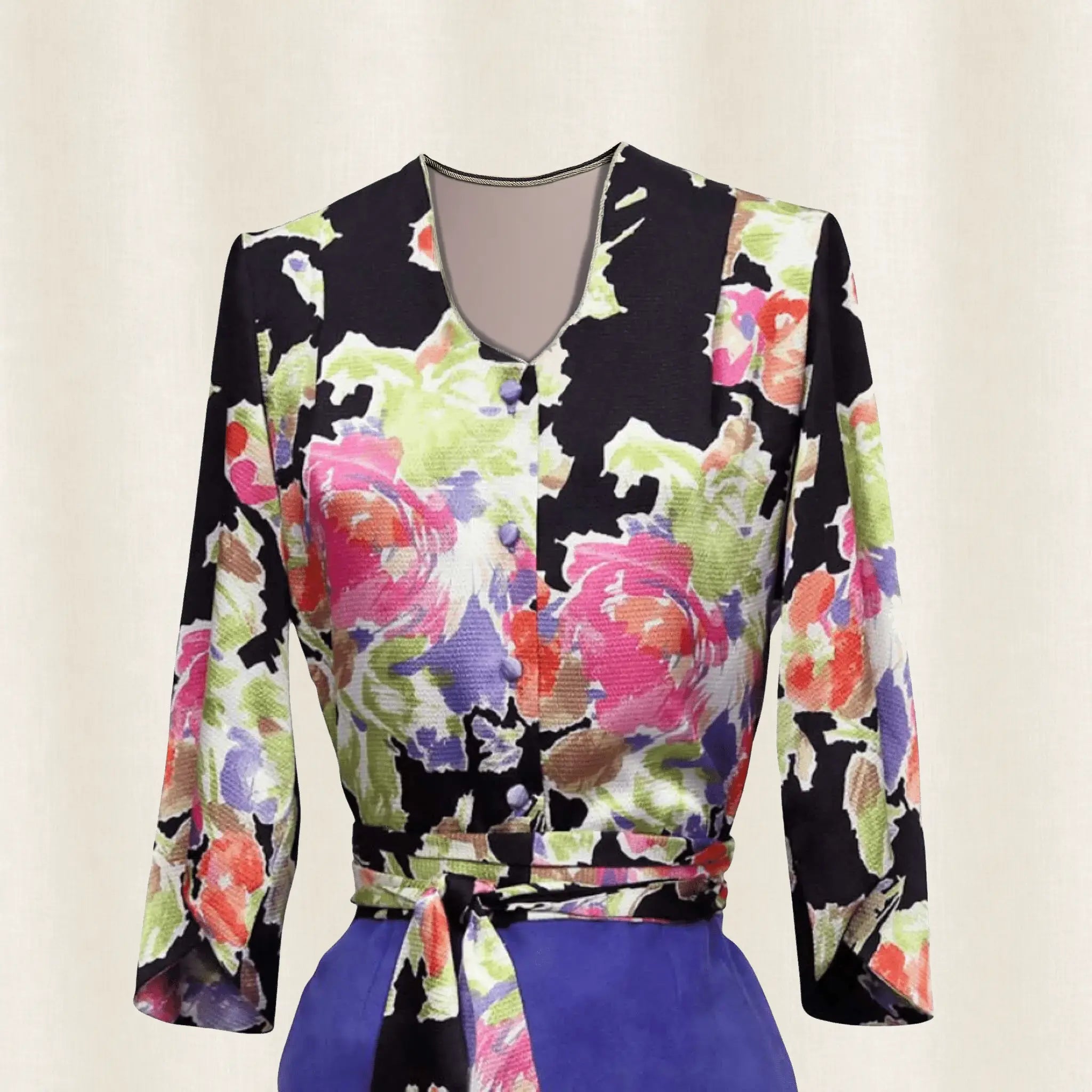 Colorful floral-patterned top with long sleeves on a light background