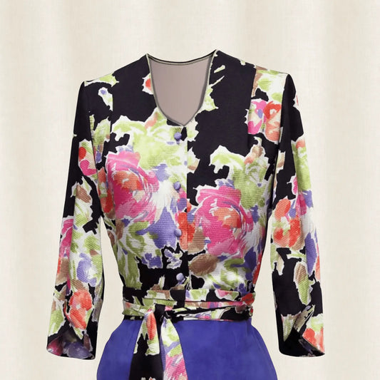 Colorful floral-patterned top with long sleeves on a light background