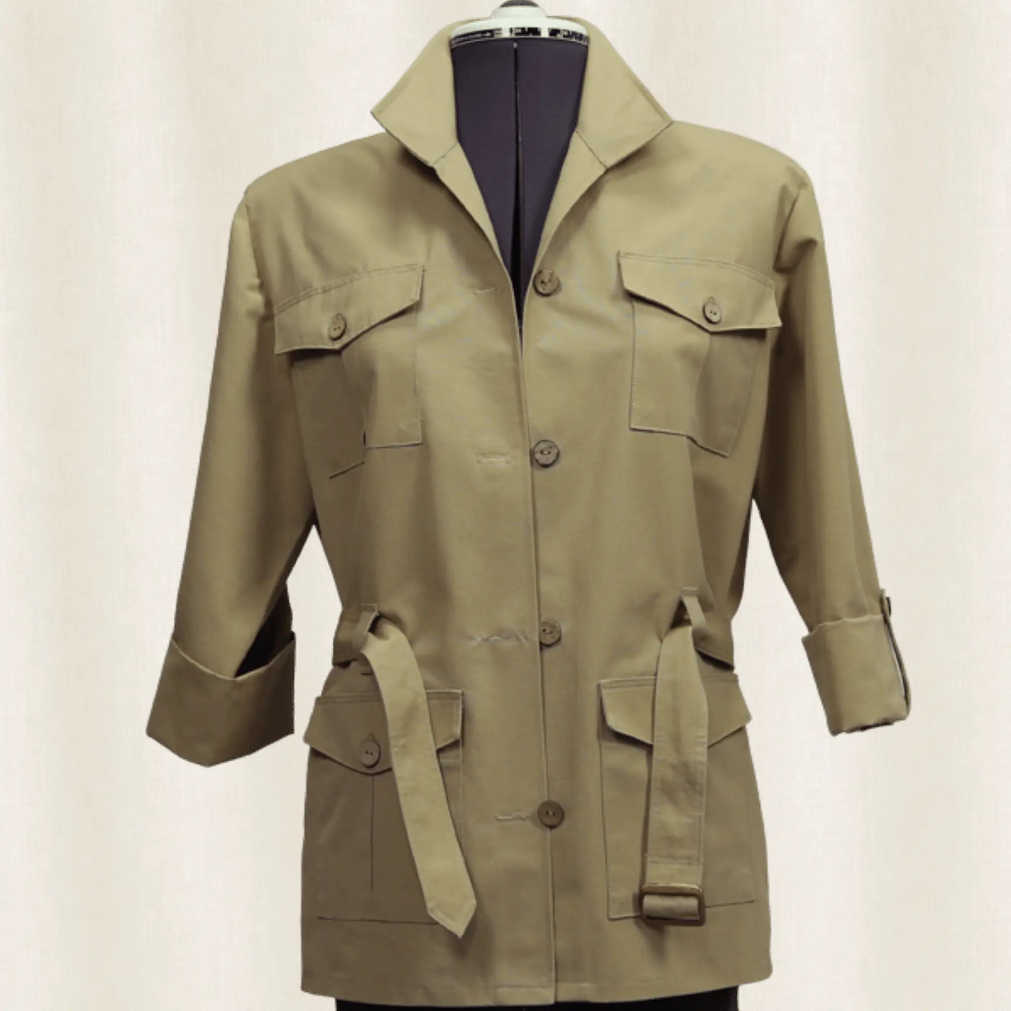 Khaki jacket on a mannequin against a plain background
