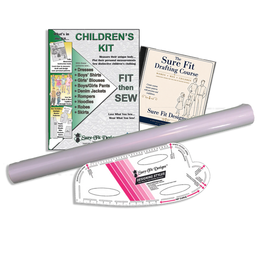 Children's sewing kit with pattern paper, ruler, and course book on a white background