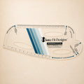 A clear plastic garment body curve tool labeled Sure Fit Designs Designing Stylus, shown on a warm beige background. The tool features blue and white striped accents and printed measurement markings.