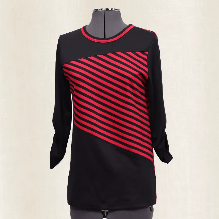 Black and red striped dress on a mannequin against a white background
