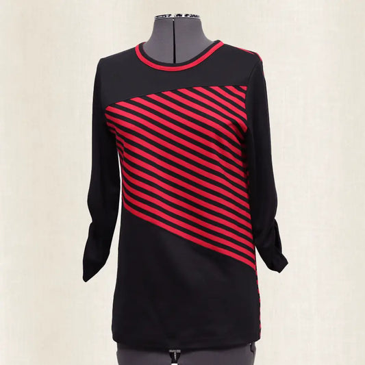 Black and red striped dress on a mannequin against a white background
