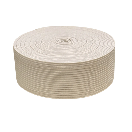 Roll of beige elastic on a white background