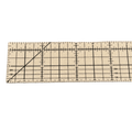 a sewing hot hemmer made of felt and marked with a black measuring grid in inches