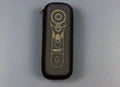 Black case with a gold and white design on a beige surface