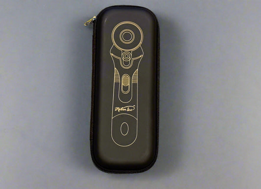 Black case with a gold and white design on a beige surface