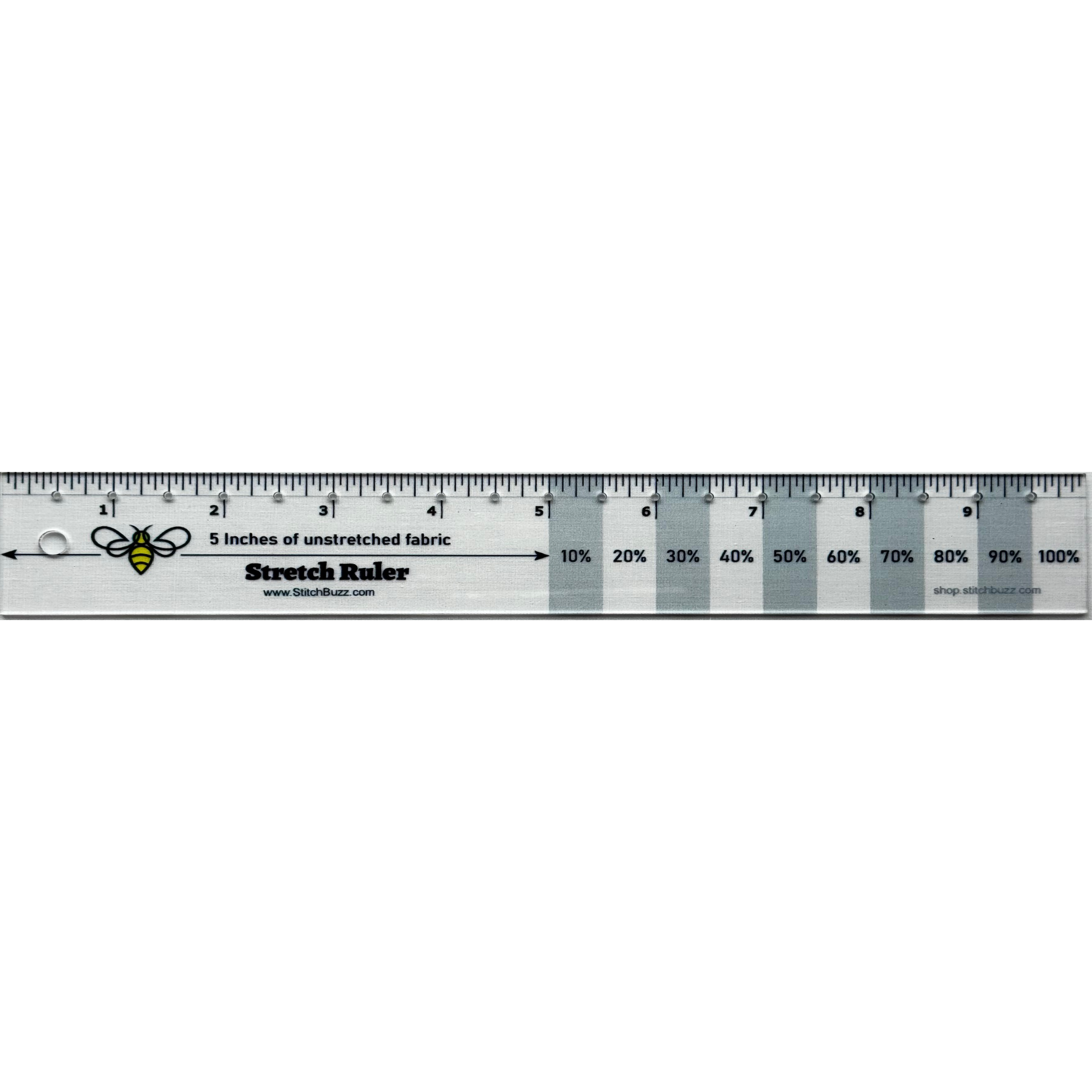 A 10-inch clear plastic ruler with gray stripes every other inch, used to measure the stretch and recovery of knit fabrics