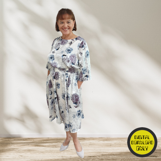 Woman wearing a floral dress standing against a light background