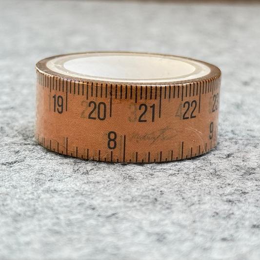 paper bag colored roll of craft tape with inches scale