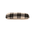 A seam roll made of white and black flannel fabric