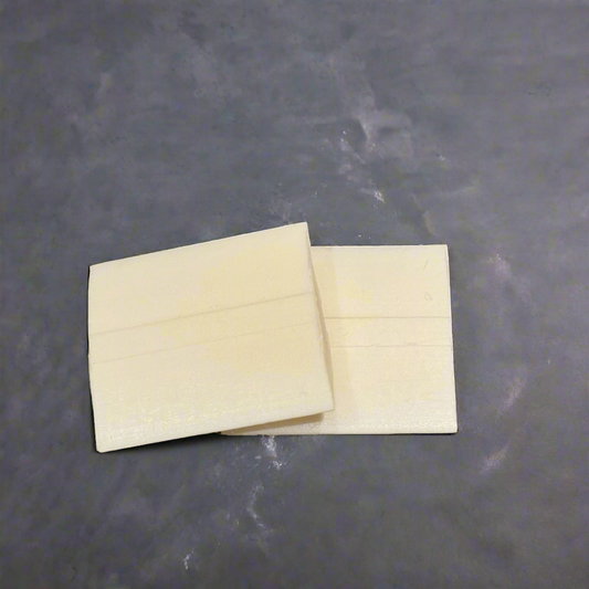 two pieces of wax tailor's chalk
