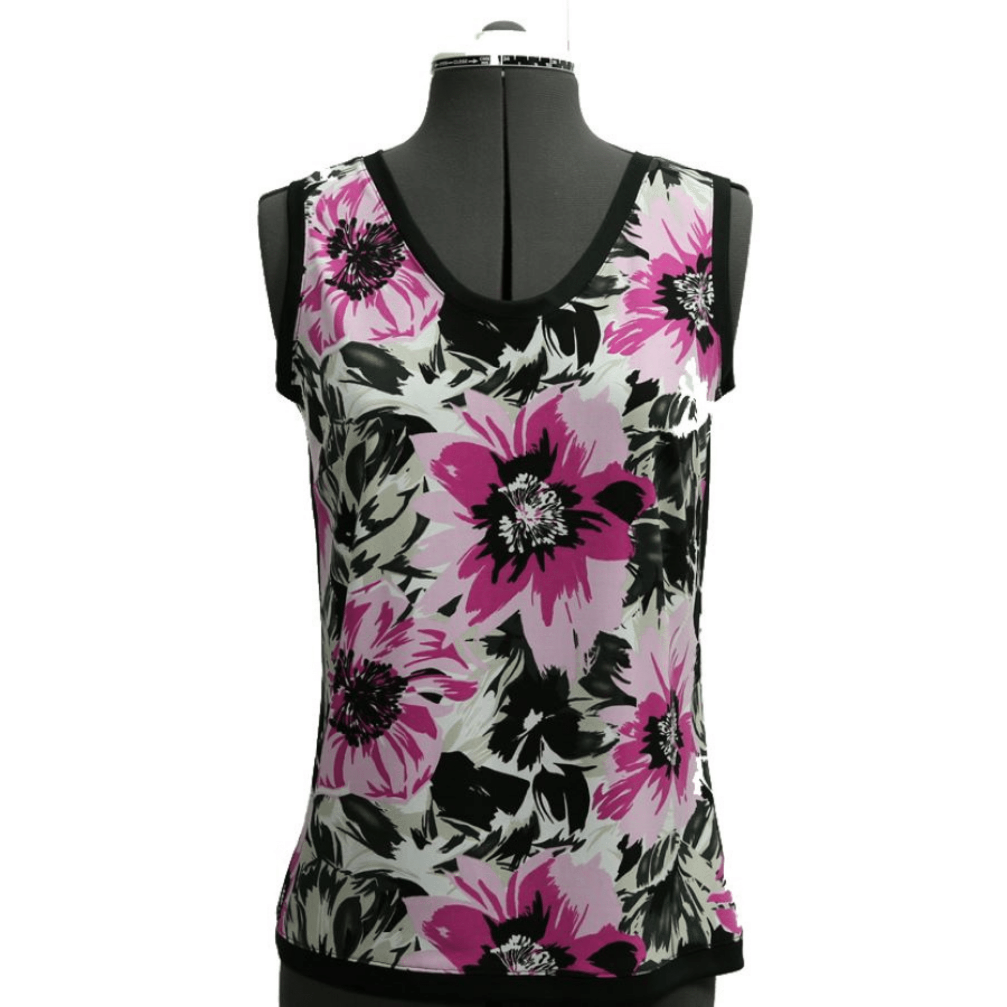 A digital sewing pattern for a tank top.  The garment is a floral tank top on a gray mannequin made of pink and black flowers on a gray background.  