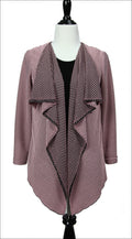 A sewing digital pattern for a flowy long sleeve open faced  jacket on a mannequin made of black and dusty pink fabric