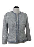 A close up of a mid zipper on a jacket made of blue brocade fabric
