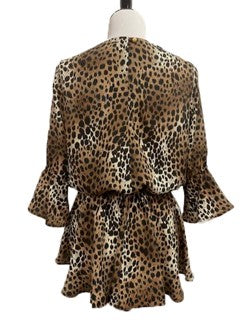 a back view of a long sleeved blouse on a mannequin that is made of cougar print fabric, it is gathered around the waist