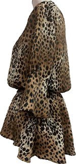 a side view of a long sleeved blouse on a mannequin that is made of cougar print fabric, it is gathered around the waist